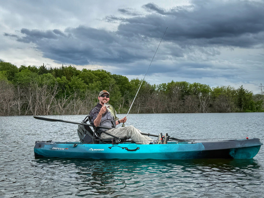 Hoodoo Impulse 120 fin drive fishing kayak on the water.