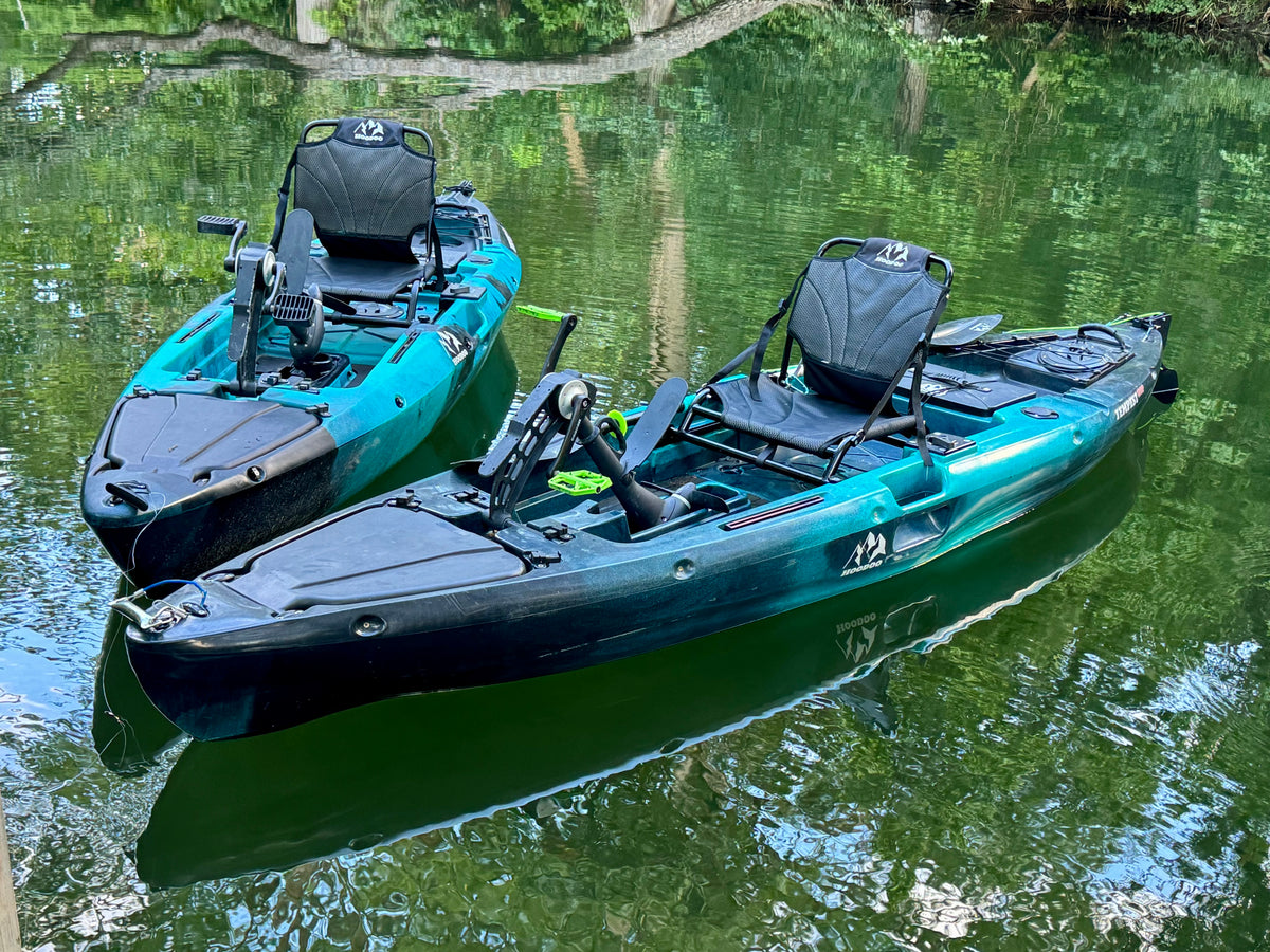 Hoodoo Tempest 120P Propeller Drive Pedal Kayak Floating on Calm Water.